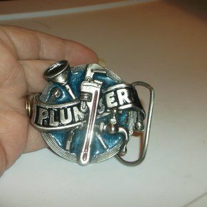 vintage heavy metal plummers belt buckle.